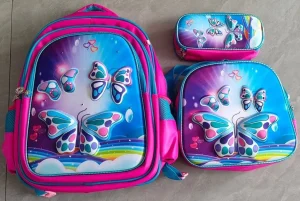 Set De Mochila Ninos Escolar Diseno Dinosaurio Trex Azul - Angeles del Hogar Chile